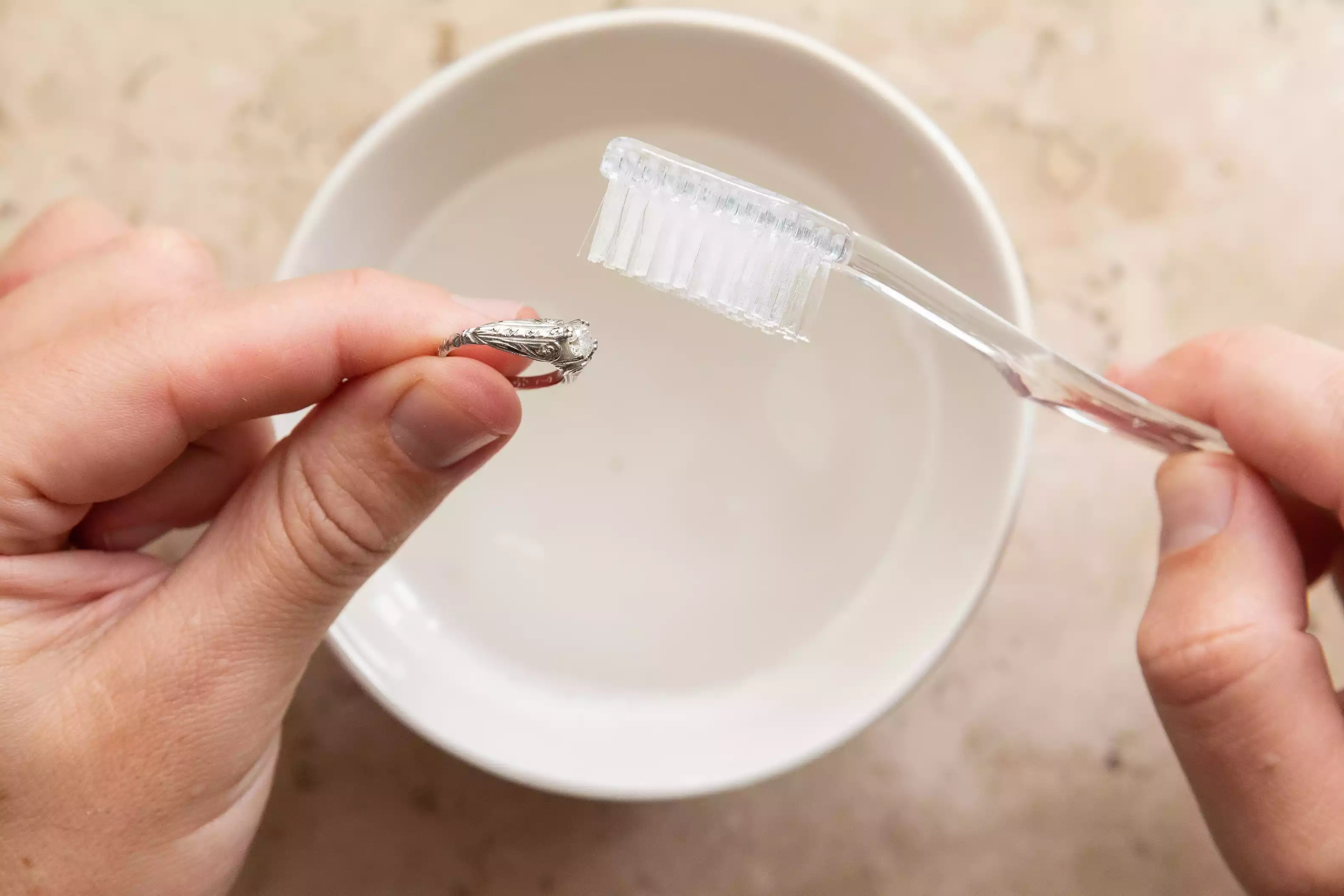 how to clean jewelry with soap and soft brush